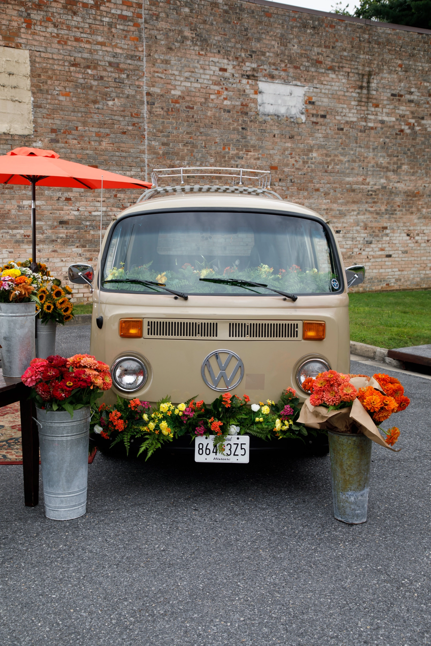 The front of the vintage VW Blooming Bus dressed with flowers
