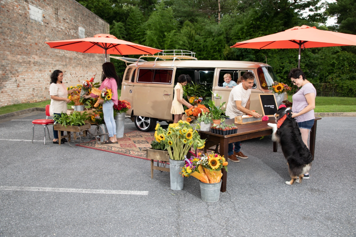 Guests building bouquets at the VW Blooming Bus flower bar